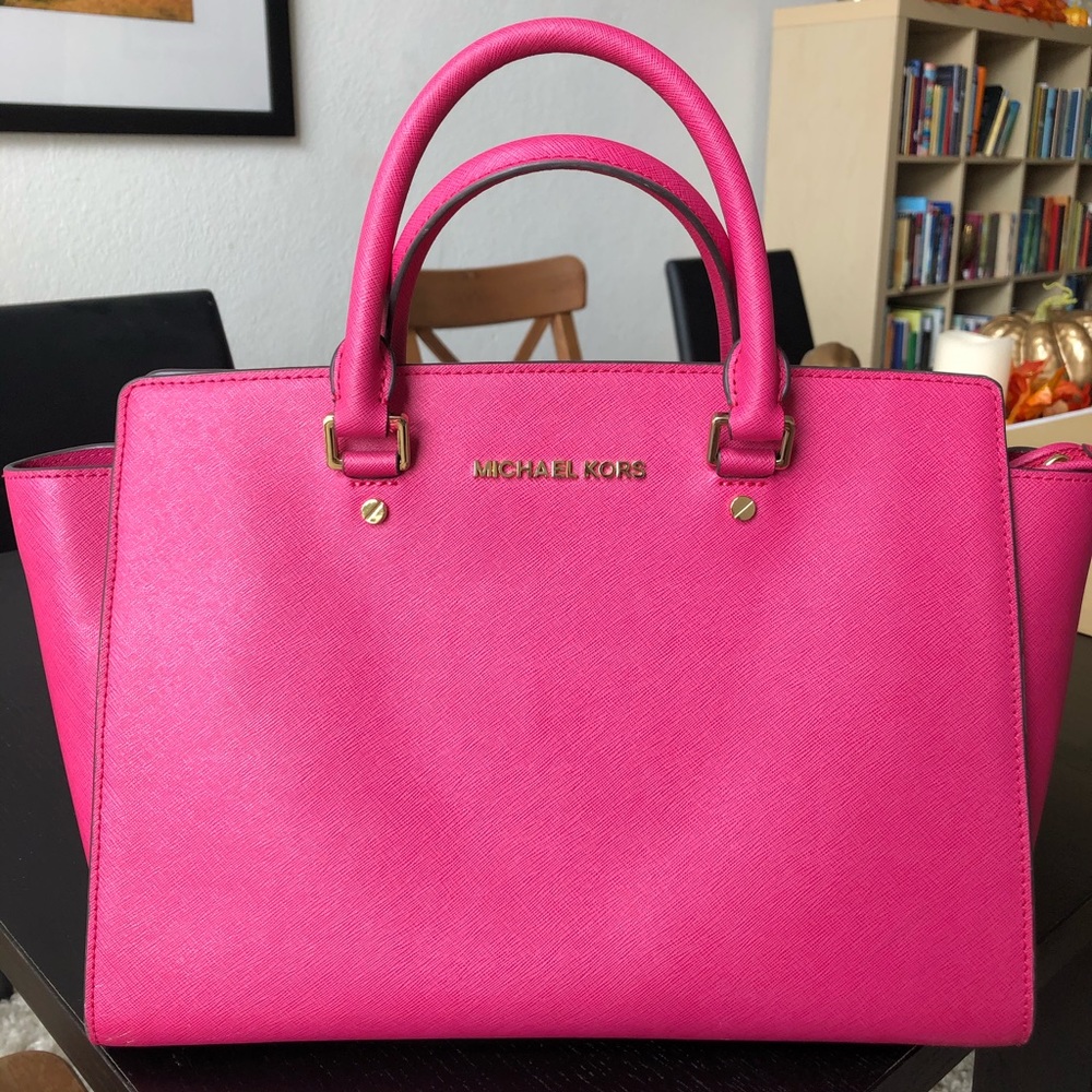 Bright Pink Michael Kors purse.